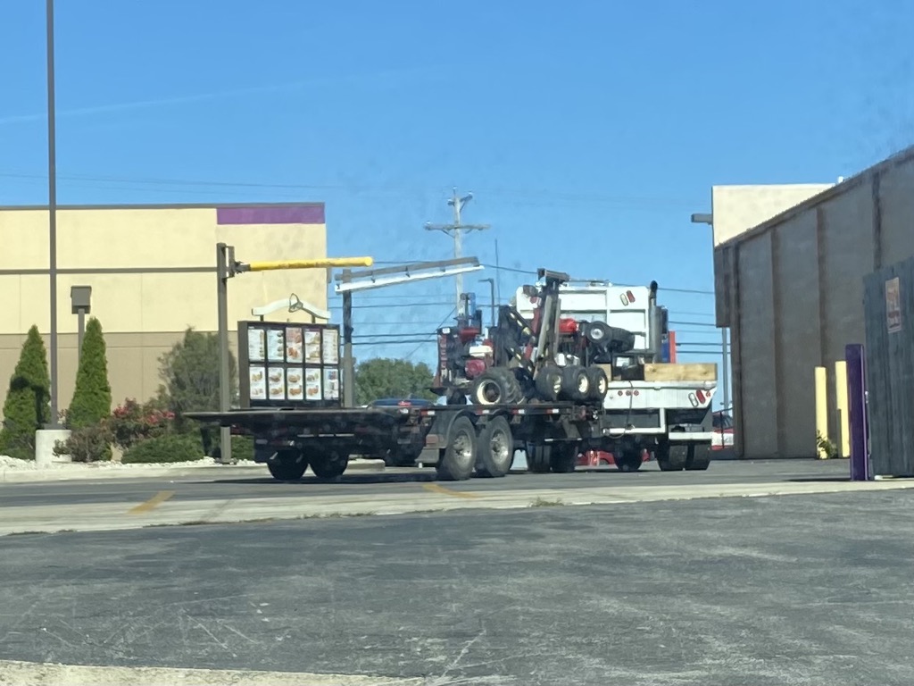 A for effort, but I don’t think you’re supposed to use the drive thru if your vehicle doesn’t fit under the bar